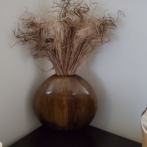 Brown tabletop vase with wooden flower